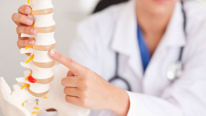 explanation of lumbar osteochondrosis in a spinal model